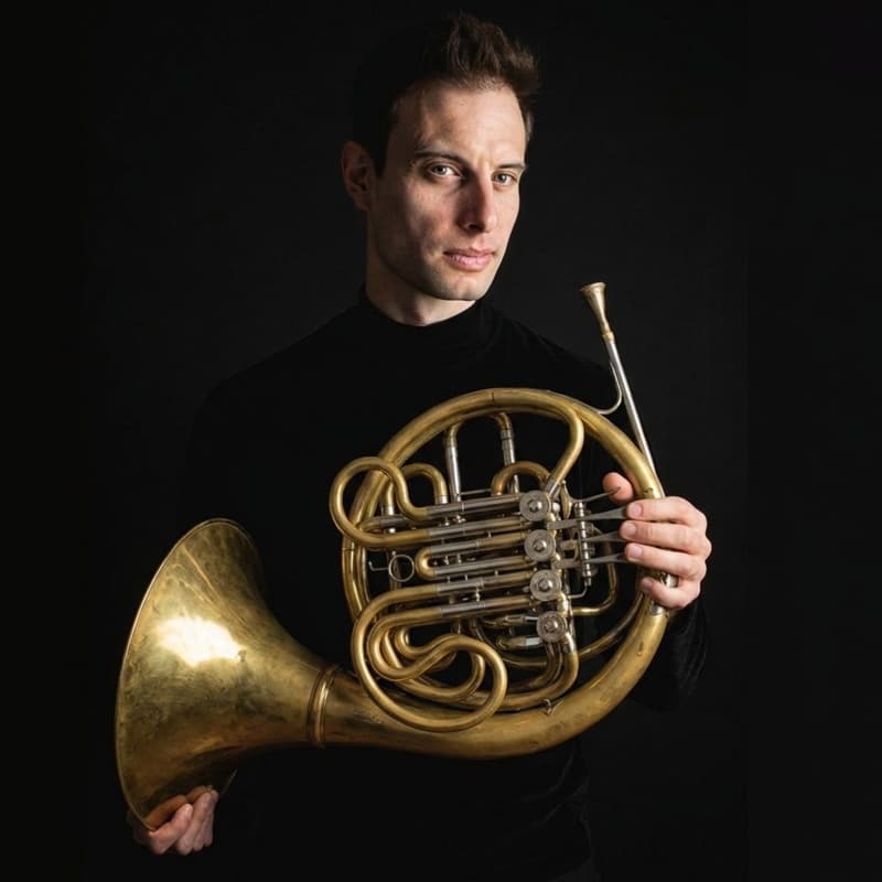 Phil Browne holding French horn